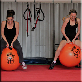 Bouncing space hoppers at the gym bbq event